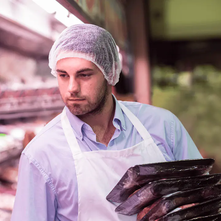 butcher-filling-shelf-with-packaged-meat-2022-12-16-22-42-34-utc nb (1).png